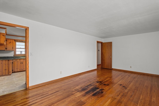 2211 Woodland Ave, Augusta, GA 30904 - empty room with baseboards and light wood finished floors