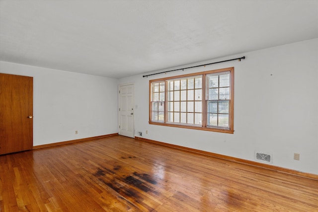 2211 Woodland Ave, Augusta, GA 30904 - spare room with wood finished floors and baseboards