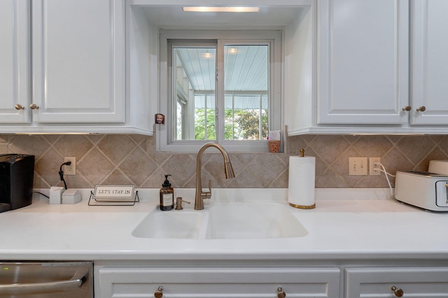 3665 Bay Point Ct, Martinez, GA 30907 - kitchen featuring dishwasher, white cabinetry, decorative backsplash, and light countertops