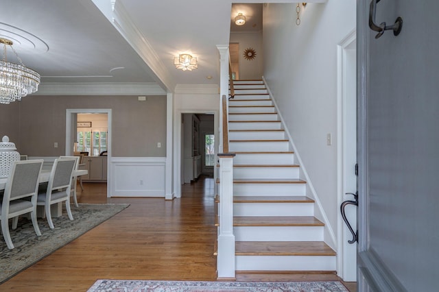 3665 Bay Point Ct, Martinez, GA 30907 - staircase featuring ornamental molding, a chandelier, and wood finished floors