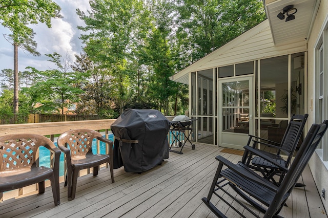 3665 Bay Point Ct, Martinez, GA 30907 - deck featuring area for grilling, a sunroom, a fenced backyard, and view of scattered trees