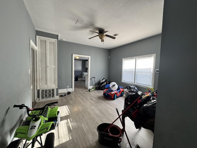 2021 Ellis St, Augusta, GA 30904 - bedroom with a textured ceiling, wood finished floors, and ceiling fan