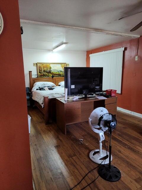 bedroom featuring dark hardwood / wood-style floors