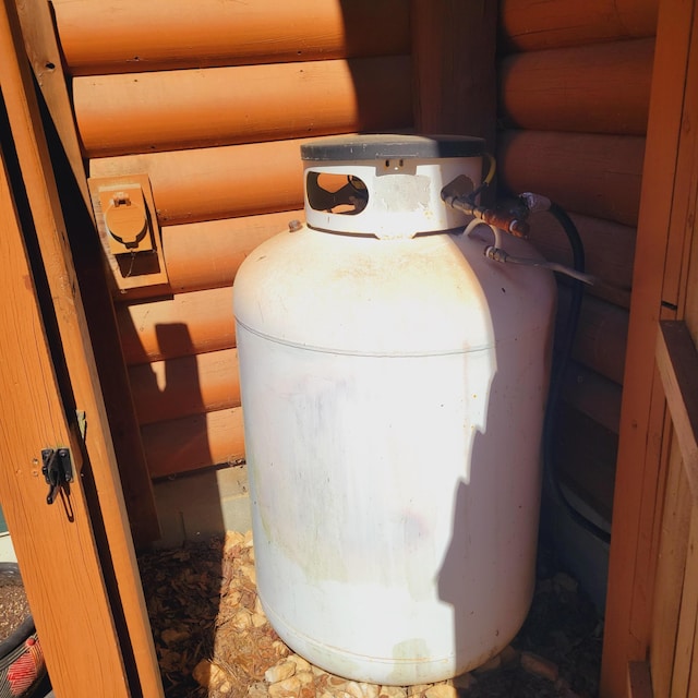 2946 Upper Mill Rd, Mccormick, SC 29835 - exterior view of heating fuel tank and faux log siding