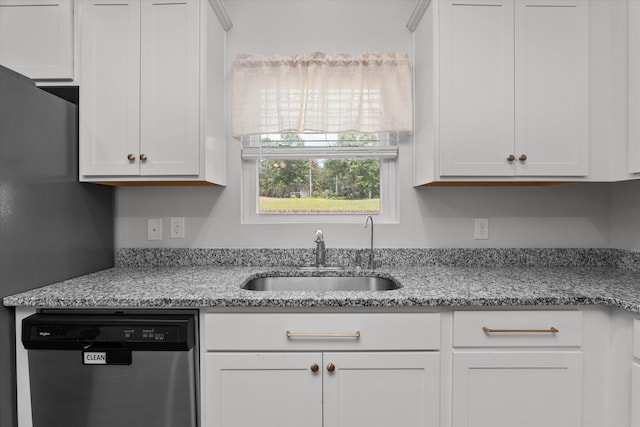 2965 Calli Crossing Dr, Graniteville, SC 29829 - kitchen with stainless steel dishwasher, white cabinetry, and light stone counters