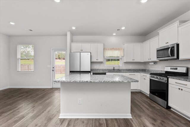 2965 Calli Crossing Dr, Graniteville, SC 29829 - kitchen featuring appliances with stainless steel finishes, a center island, white cabinetry, dark wood-style flooring, and recessed lighting