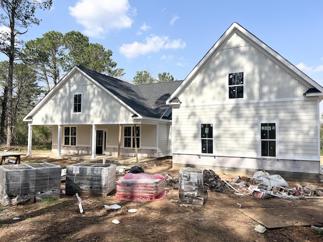 rear view of house with central AC unit