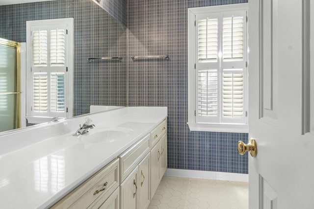 bathroom featuring tile patterned flooring and vanity