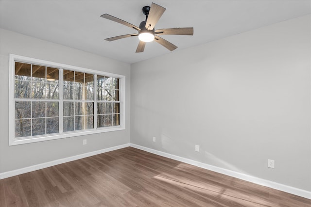 empty room with wood-type flooring and ceiling fan