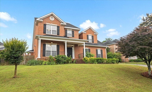 traditional-style home featuring brick siding and a porch