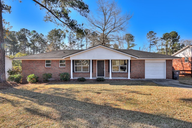 2140 Chadwick Rd, Augusta, GA 30906 - ranch-style home with a front lawn, covered porch, brick siding, an attached garage, and aphalt driveway