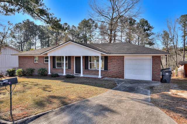 2140 Chadwick Rd, Augusta, GA 30906 - single story home featuring a garage, a porch, brick siding, and concrete driveway