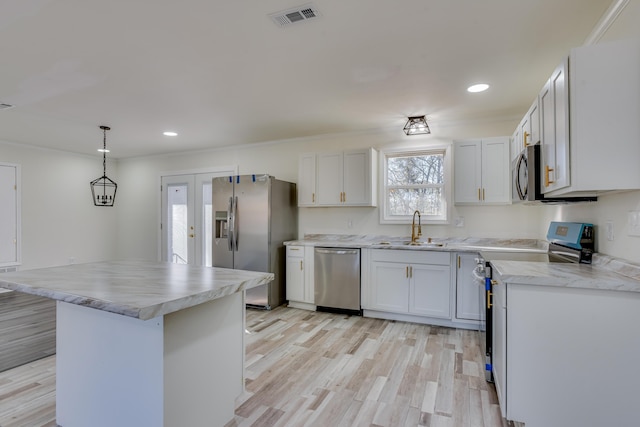 2140 Chadwick Rd, Augusta, GA 30906 - kitchen with light countertops, visible vents, a sink, and appliances with stainless steel finishes
