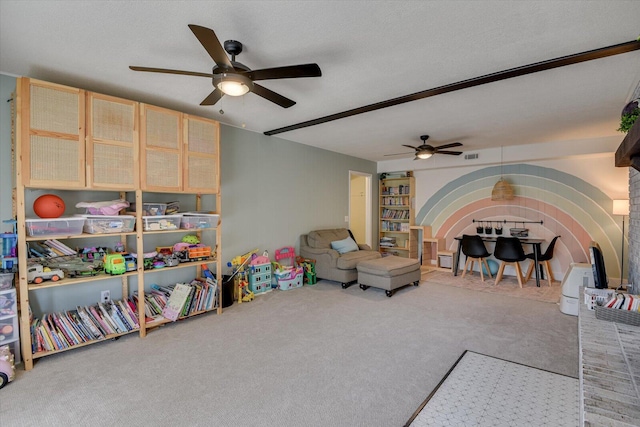 game room featuring a textured ceiling and carpet