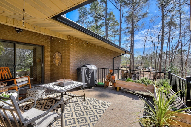 view of patio with a grill