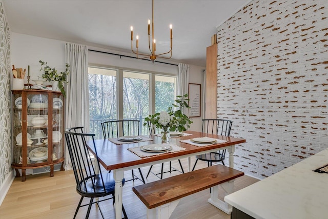 dining room featuring a chandelier and light wood finished floors