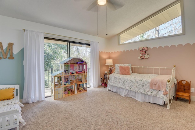 bedroom with ceiling fan, carpet, and lofted ceiling