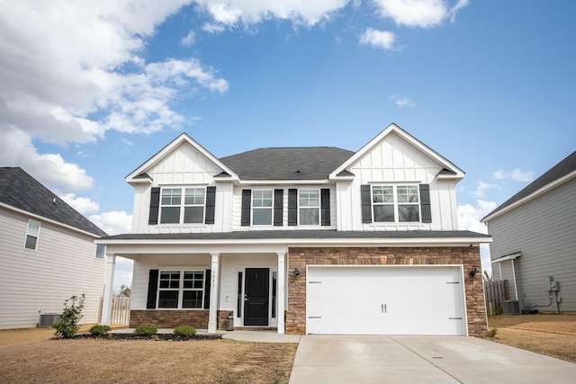 craftsman-style home featuring a porch, cooling unit, a garage, concrete driveway, and board and batten siding