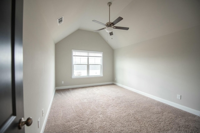 spare room with carpet floors, baseboards, visible vents, and ceiling fan
