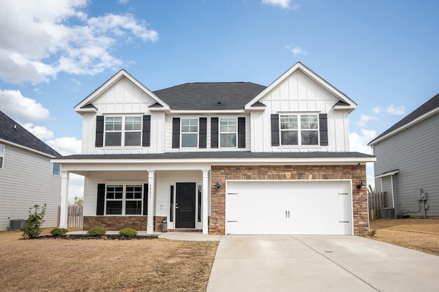 view of front of property featuring board and batten siding, concrete driveway, a porch, and an attached garage