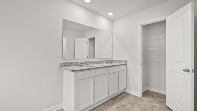 417 Kentbury Ct, Aiken, SC 29801 - full bathroom featuring double vanity, baseboards, recessed lighting, and a spacious closet