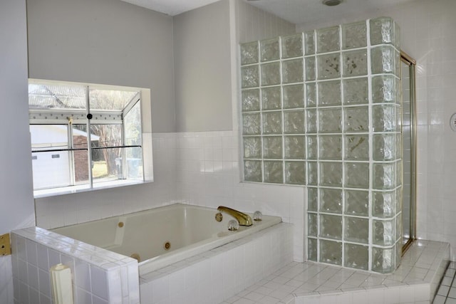 full bathroom featuring a walk in shower and a tub with jets