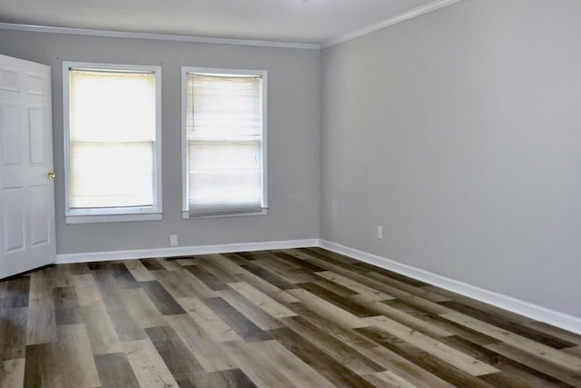 unfurnished room with baseboards, dark wood finished floors, and ornamental molding