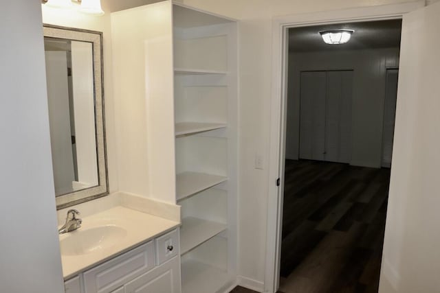 bathroom featuring vanity and wood finished floors