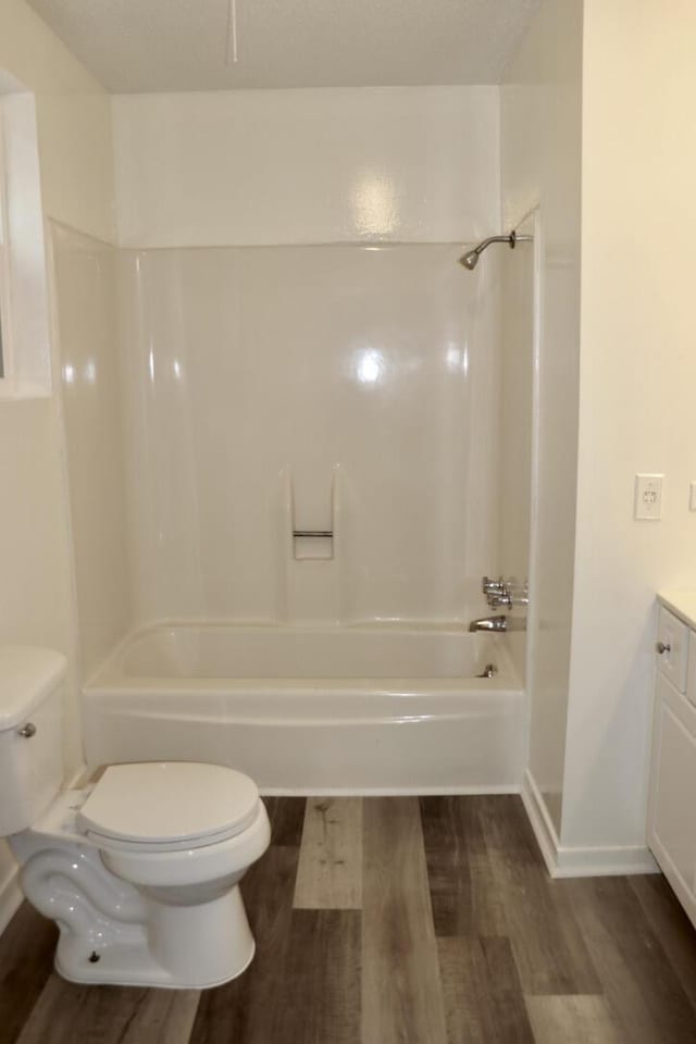 full bathroom with vanity, shower / bathing tub combination, toilet, and wood finished floors