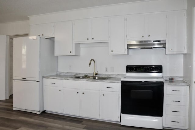 kitchen with a sink, range with electric stovetop, range hood, white cabinetry, and freestanding refrigerator