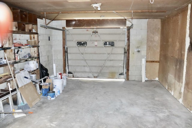 garage with concrete block wall