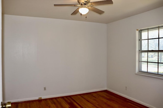 unfurnished room featuring wood finished floors, a ceiling fan, and baseboards