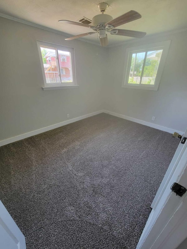 empty room with ceiling fan and ornamental molding