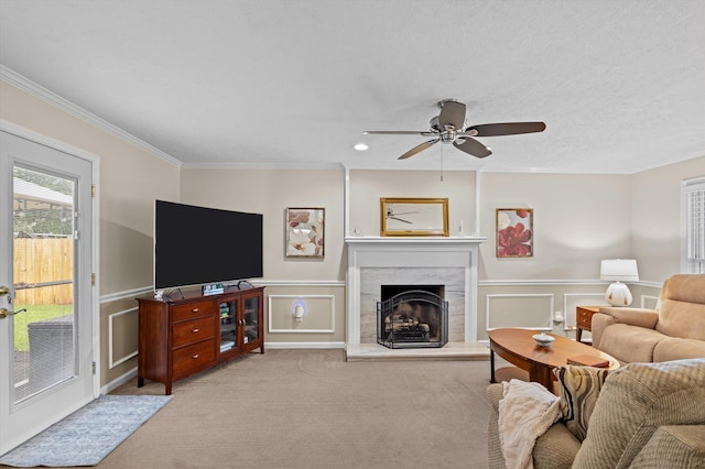 492 Pheasant Run Dr, Evans, GA 30809 - living area featuring crown molding, a decorative wall, a ceiling fan, a high end fireplace, and carpet