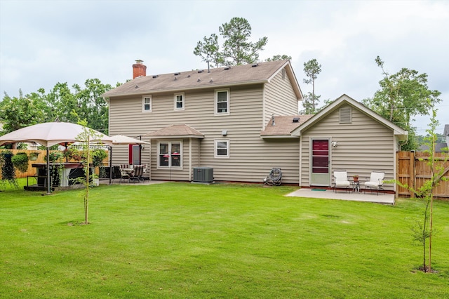 492 Pheasant Run Dr, Evans, GA 30809 - back of house featuring a patio, central AC unit, and a shingled roof