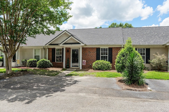 55 Charlestowne Dr, Augusta, GA 30907 - view of front facade featuring a shingled roof, brick siding, and stucco siding