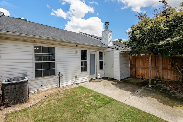 55 Charlestowne Dr, Augusta, GA 30907 - rear view of house featuring a shingled roof, a patio area, and a chimney