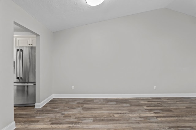 55 Charlestowne Dr, Augusta, GA 30907 - spare room with wood finished floors and vaulted ceiling