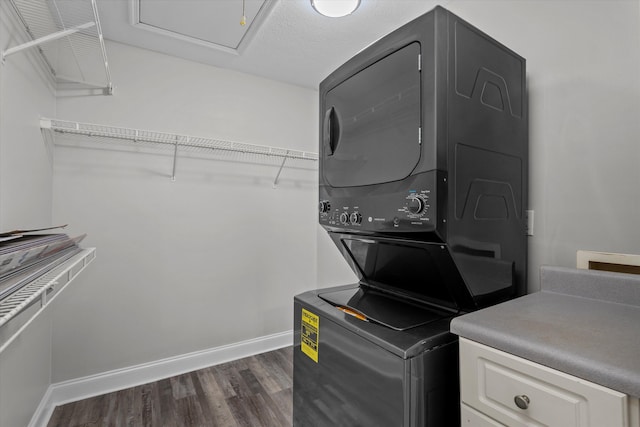 55 Charlestowne Dr, Augusta, GA 30907 - washroom featuring stacked washer / drying machine and dark wood finished floors