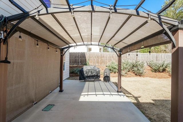 view of patio / terrace with a fenced backyard and a pergola