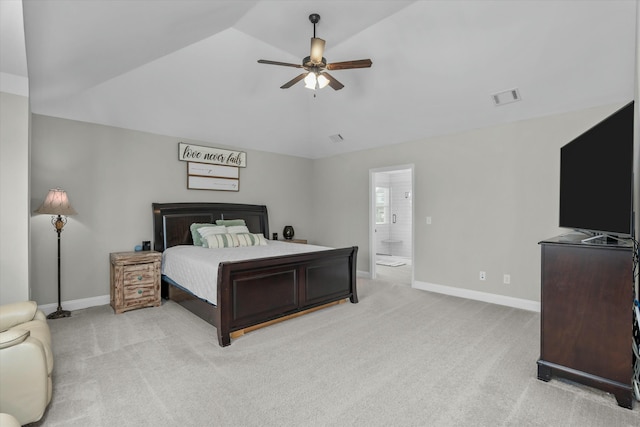 bedroom featuring lofted ceiling, baseboards, visible vents, and light colored carpet