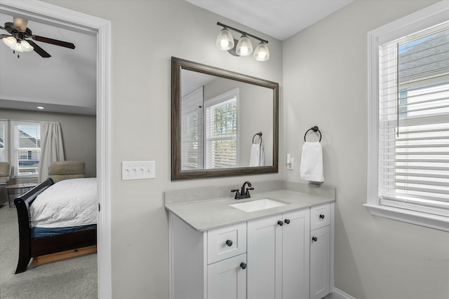 bathroom featuring ensuite bathroom, plenty of natural light, vanity, and a ceiling fan