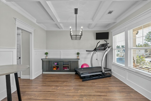 workout area with coffered ceiling, visible vents, and wood finished floors