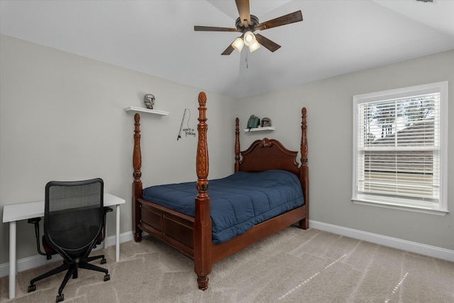 bedroom with a ceiling fan, carpet flooring, and baseboards