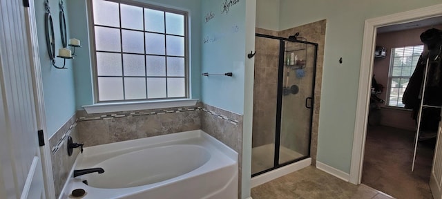 bathroom with plus walk in shower and tile patterned flooring