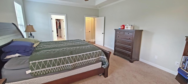 carpeted bedroom featuring crown molding