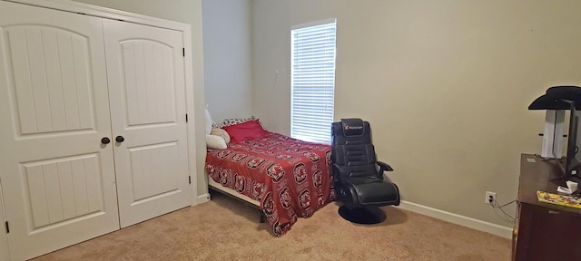 carpeted bedroom with a closet