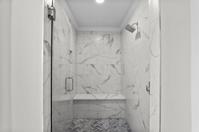 full bath with crown molding and a shower stall