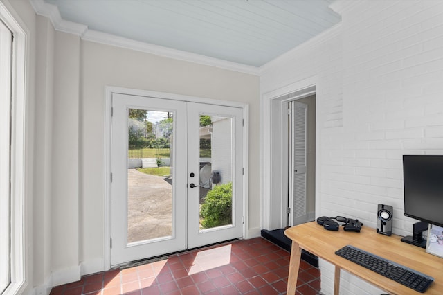 entryway featuring dark tile patterned flooring, baseboards, ornamental molding, and french doors