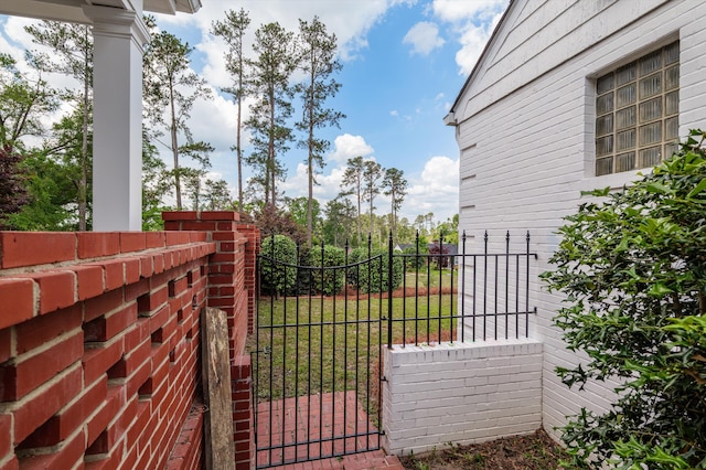 view of gate featuring fence